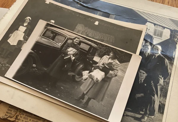A pile of black and white photographs