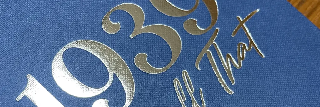 A blue hardback book with a gold embossed cover, produced by Book of My Life